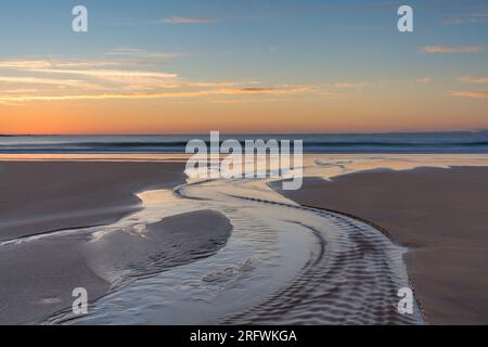 Coucher de soleil, Kiloran Bay, Colonsay, Écosse Banque D'Images