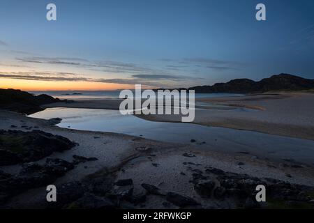 Dernière lumière, Kiloran Bay, Colonsay, Écosse Banque D'Images