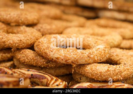 Close up pastry rings with sesame consumed in holy days. Kandil simidi is at native language. Selective focus of pastry rings. Stock Photo