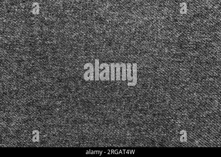 Texture de tissu de laine dense noir pour la confection. Textile. Matériau. Laine Banque D'Images