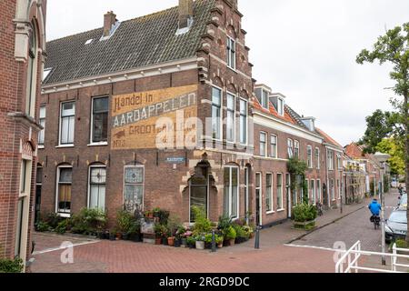 Maison (ancien commerce de pommes de terre) avec une copie des mangeurs de pommes de terre de Vincent van Gogh, Delft, pays-Bas Banque D'Images