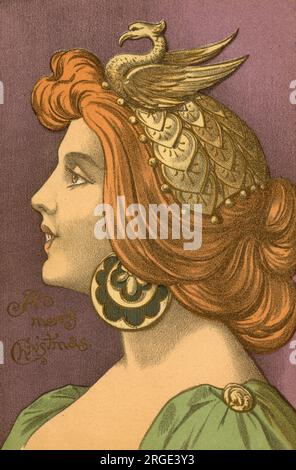 Carte postale de voeux de Noël représentant une jeune femme glamour aux cheveux de flamme avec une coiffe antique en forme de phénix et de grandes boucles d'oreilles circulaires Banque D'Images