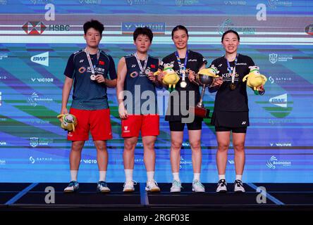 L’équipe gagnante Kim So Yeong et Kong Hee Yong, de Corée, posent avec les finalistes Liu Sheng Shu et Tan Ning, de Chine, après le match de finale du double féminin de Banque D'Images