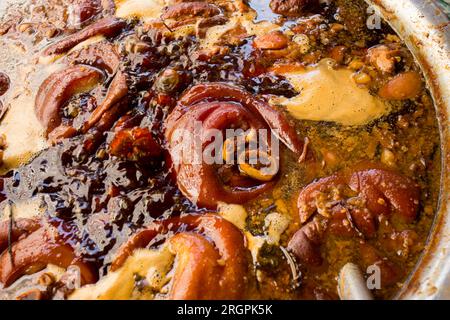 Porc dans un stand de nourriture de rue dans la ville de Bangkok en Thaïlande. Banque D'Images