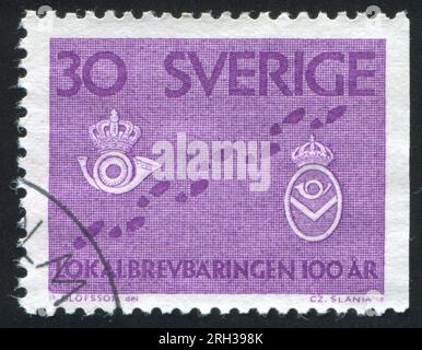 SUÈDE - CIRCA 1962 : timbre imprimé par la Suède, montrant des pas et des badges de facteur, circa 1962 Banque D'Images