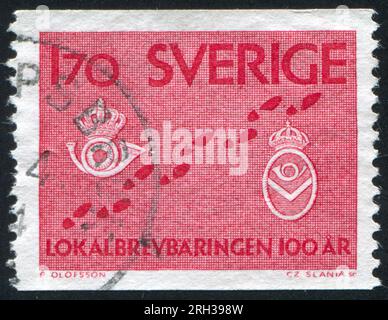 SUÈDE - CIRCA 1962 : timbre imprimé par la Suède, montrant des pas et des badges de facteur, circa 1962 Banque D'Images