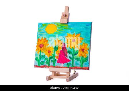 Petite fille en robe dans le champ fleuri de fleurs peinture à l'huile sur toile, image sur un trépied d'art. Banque D'Images