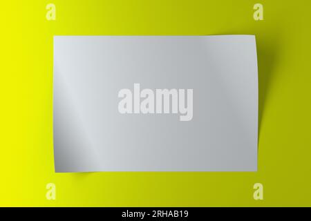 Un morceau de papier blanc avec des bords incurvés sur fond vert Banque D'Images
