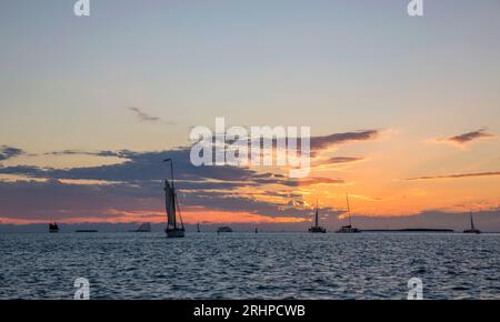 Key West, Florida, USA. View across the Gulf of Mexico from Mallory Square, Old Town, sunset, yachts returning to port. Stock Photo