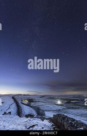 Hadrian's Wall under a starry night sky - the view looking west from Cawfield Crags. Stock Photo