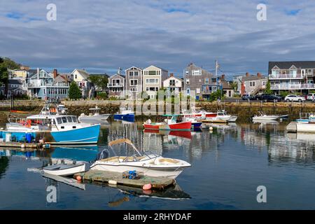 Rockport - A sunny Autumn morning view of colorful fishing boats docking in the peaceful inner harbor of Rockport, Massachusetts, USA. Stock Photo
