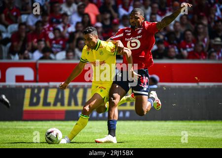 20 août 2023, Villeneuve-d'Ascq, France : Mostafa MOHAMED de Nantes et Alexsandro VICTOR DE SOUZA RIBEIRO de Lille lors du match de Ligue 1 entre Lille OSC (LOSC) et FC Nantes au stade Pierre Mauroy le 20 août 2023 à Villeneuve-d'Ascq près de Lille, France. (Image de crédit : © Matthieu Mirville/ZUMA Press Wire) USAGE ÉDITORIAL SEULEMENT! Non destiné à UN USAGE commercial ! Banque D'Images