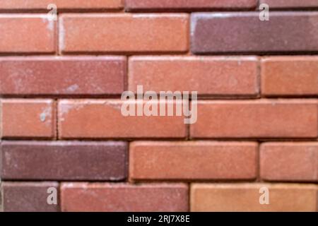 Fond de texture de mur de brique rouge vieux et vieilli avec vignettage. Mur de briques rouges. Mur de briques. Banque D'Images