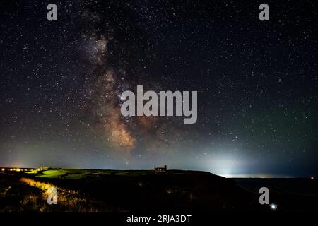 The summer Milky Way setting over St Materiana's Church, Tintagel, Cornwall, UK Stock Photo