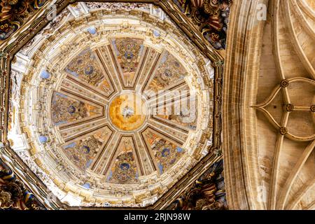 Salamanca, Spain, 06.10.21. Richly decotated baroque dome and stone vaults in New Cathedral (Catedral Nueva) in Salamanca, with colorful paintings. Stock Photo