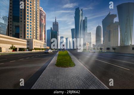 A picturesque photo captures the stunning Qatar Corniche road in all its glory during the FIFA World Cup. The winter afternoon sun casts an awesome sp Stock Photo