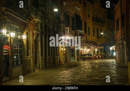 Sidewalk of storefronts in Venice, Italy Stock Photo