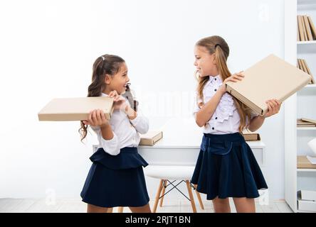 ready for school lesson. two girls in school class. education and knowledge. school fight. children girls holding folder. high school education. educa Stock Photo