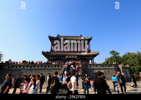 Qinhuangdao City, China - October 4, 2018: A girl Chinese traditional ancient architecture landscape on the Great Wall, Qinhuangdao City, Hebei Provin Stock Photo