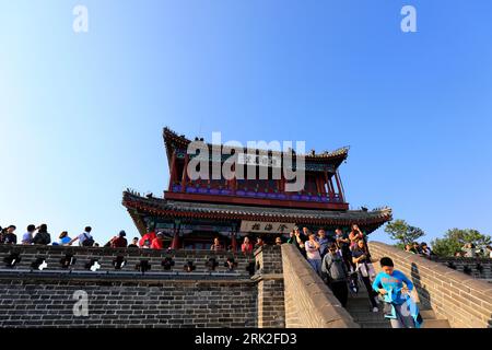 Qinhuangdao City, China - October 4, 2018: A girl Chinese traditional ancient architecture landscape on the Great Wall, Qinhuangdao City, Hebei Provin Stock Photo