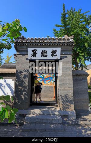 Qinhuangdao City, China - October 4, 2018: A girl is at the entrance of the ancient building's gate, Qinhuangdao City, Hebei Province, China Stock Photo