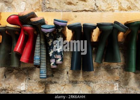 Wellington Boots on rack Stock Photo