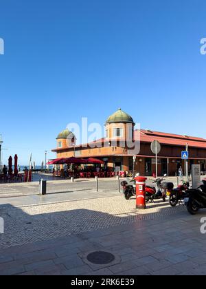 The famous red buildings of the Mercado Municipal Olhaos in Olhao, a city in the Algarve Stock Photo