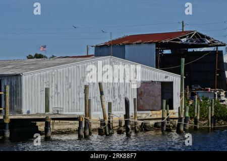 An Old metal warehouse & dock by the harbor in Tarpon Springs, Florida. Stock Photo