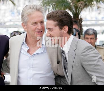 (100514) -- CANNES, May 14, 2010 (Xinhua) -- Cast members Michael Douglas (L) and Shia LaBeouf talk during a photocall for the film Wall Street - Money Never Sleeps at the 63rd Cannes Film Festival in Cannes, France, May 14, 2010. (Xinhua/Dong Feng) (zl) (9)FRANCE-CANNES-FILM FESTIVAL-WALL STREET PUBLICATIONxNOTxINxCHN   100514 Cannes May 14 2010 XINHUA Cast Members Michael Douglas l and Shia LaBeouf Talk during a photo call for The Film Wall Street Money Never Sleeps AT The 63rd Cannes Film Festival in Cannes France May 14 2010 XINHUA Dong Feng ZL 9 France Cannes Film Festival Wall Street PUB Stock Photo