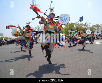 Bildnummer: 54073133  Datum: 24.05.2010  Copyright: imago/Xinhua (100524) -- SHANGHAI, May 24, 2010 (Xinhua) -- Drummers dance during a parade at the World Expo Park in Shanghai, east China, May 24, 2010. A grand parade named walking towards happiness was held here Monday, the opening day of Inner Mongolia Week of the Shanghai World Expo, demonstrating the Inner Mongolia-related elements like Mongolian horses, Mongolian yurts to embody the cultural achievements of the Mongolia ethnic group. (Xinhua/Xu Yu) (lyx) (1)WORLD EXPO-INNER MONGOLIA WEEK-PARADE (CN) PUBLICATIONxNOTxINxCHN Gesellschaft W Stock Photo