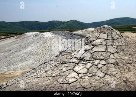 Bildnummer: 54143889  Datum: 13.06.2010  Copyright: imago/Xinhua (100614) -- June 14, 2010 (Xinhua) -- The photo taken on June 13, 2010 shows the Muddy Volcanoes in Berca, Buzau County, Romania. The Berca Mud Volcanoes are a geological and botanical reservation. The mud volcanoes have the shape and act as a real volcano, but at much smaller scale; the eruptions are a cold mixture of gases and mud. This phenomenon is rarely met in Europe and is very spectacular. (Xinhua/Gabriel Petrescu) (4)ROMANIA-MUD VOLCANOES PUBLICATIONxNOTxINxCHN Natur Gesellschaft Vulkan Rumänien aktiv aktiver Schlammvulk Stock Photo