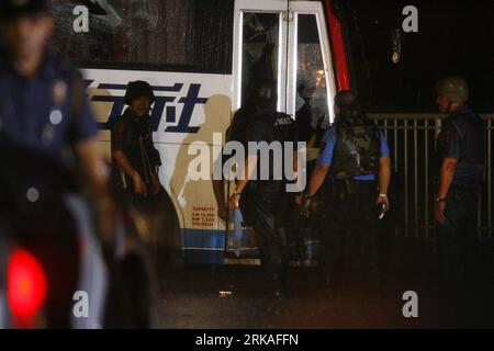 The body of hostage-taker Rolando Mendoza, 55, hangs from the glass ...