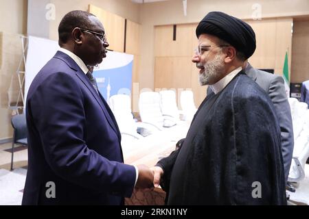 Johannesburg, Gauteng, Afrique du Sud. 24 août 2023. Le président iranien Ebrahim Raisi (à droite) rencontre le président sénégalais Macky Sall (à gauche) dans le cadre du 15e sommet des BRICS. (Image de crédit : © Présidence iranienne via ZUMA Press Wire) USAGE ÉDITORIAL SEULEMENT! Non destiné à UN USAGE commercial ! Banque D'Images