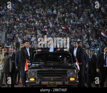 Bildnummer: 58561999  Datum: 06.10.2012  Copyright: imago/Xinhua Egyptian President Mohamed Morsi (C) attends a celebration ceremony for the 39th anniversary of the Oct.-6 war against Israel, at Cairo International Stadium in Cairo, Egypt, Oct. 6, 2012. Egypt on Saturday held a large celebration commemorating the 39th anniversary of the Oct.-6 war launched against Israel in 1973, which Egypt deems as a victorious feat that boosted the Arab countries morale. (Xinhua/The Egyptian Presidency) EGYPT-ISRAEL-OCT. 6-WAR-CELEBRATION PUBLICATIONxNOTxINxCHN People Politik Gesellschaft Militär Jahrestag Stock Photo