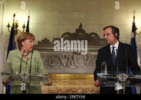 Bildnummer: 58570076  Datum: 09.10.2012  Copyright: imago/Xinhua (121010) -- ATHENS, Oct. 10, 2012 (Xinhua) -- Greek Prime Minister Antonis Samaras (R) and German Chancellor Angela Merkel attend a press conference in Athens Oct. 9, 2012. Merkel on Tuesday voiced hope that Greece would overcome its challenges and remain in the eurozone, during her first visit to Athens since the start of the debt crisis which has cast a dark shadow over Europe since 2008. (Xinhua/Thanassis Stavrakis) (ctt) GREECE-ATHENS-SAMARAS-MERKEL PUBLICATIONxNOTxINxCHN People Politik PK Pressetermin xdp x0x 2012 quer Highl Stock Photo