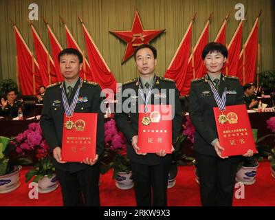 Bildnummer: 58645883  Datum: 29.10.2012  Copyright: imago/Xinhua (121029) -- BEIJING, Oct. 29, 2012 (Xinhua) -- Chinese astronauts Liu Wang, Jing Haipeng and Liu Yang (from L to R) attend an awarding ceremony to honor the Shenzhou-9 flight crew in Beijing, capital of China, Oct. 29, 2012. Three astronauts of the Shenzhou-9 mission who conducted China s first manned space docking in June have received awards for their service to the country s space endeavors. Jing Haipeng, commander of the Shenzhou-9 flight crew, was honored with a second-class aerospace achievement medal; Liu Wang and Liu Yang Stock Photo