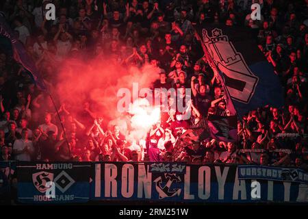 Hanover, Germany. 26th Aug, 2023. Soccer: 2nd Bundesliga, Hannover 96 - Hamburger SV, Matchday 4, Heinz von Heiden Arena. HSV fans set off pyrotechnics. Credit: Swen Pförtner/dpa - IMPORTANT NOTE: In accordance with the requirements of the DFL Deutsche Fußball Liga and the DFB Deutscher Fußball-Bund, it is prohibited to use or have used photographs taken in the stadium and/or of the match in the form of sequence pictures and/or video-like photo series./dpa/Alamy Live News Stock Photo