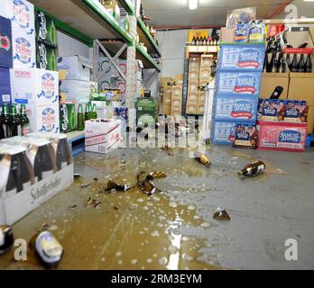 Bildnummer: 60168104  Datum: 21.07.2013  Copyright: imago/Xinhua (130721) -- WELLINGTON, July 21, 2013 (Xinhua) -- Broken bottles litter the floor of Regional Wines and Spirits shop after a 6.5 magnitude earthquake shook New Zealand capital Wellington July 21, 2013. A 6.5 magnitude earthquake shook New Zealand capital Wellington and upper South Island on Sunday afternoon, following an earlier 5.8 quake on Sunday morning and a swarm of smaller quakes throughout the day. (Xinhua/SNPA/Ross Setford) (zw) NEW ZEALAND-WELLINGTON-EARTHQUAKE PUBLICATIONxNOTxINxCHN Gesellschaft Naturkatastrophe Erdbebe Stock Photo