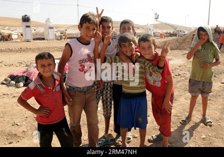 Bildnummer: 60391677  Datum: 25.08.2013  Copyright: imago/Xinhua ERBIL, Aug. 25, 2013 - Syrian children pose for a group photo at Kawergost Refugee Camp, some 50 km north of Erbil, capital of Iraq s autonomous Kurdish region, Aug. 25, 2013. Iraq s autonomous Kurdish region government ordered on Aug. 15 to open the border with Syria to help thousands of mainly Kurdish Syrians to flee the violence in their country. According to the UNHCR, at least 45,000 Syrian refugees entered Iraq s Kurdish region in the recent influx after the regional authorities decided to open the border for them, raising Stock Photo