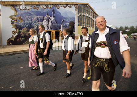 Bildnummer: 60443735  Datum: 06.09.2013  Copyright: imago/Xinhua Band members from Munich of Germany arrive to attend an Oktoberfest beer festival affiliated to the original version of the German event at the Olympic Park in Beijing, capital of China, Sept. 6, 2013. German beer, Bavarian food, and bands from Munich would serve the public throughout the two-week festival. This was the first time for the Munich Oktoberfest, the world s biggest beer festival, to be staged in Beijing. (Xinhua/Zhao Bing) (ry) CHINA-BEIJING-MUNICH BEER FESTIVAL (CN) PUBLICATIONxNOTxINxCHN Gesellschaft Festzelt Oktob Stock Photo