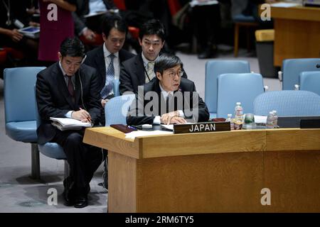 (140129) -- New York, 29 janv. 2014 (Xinhua) -- Kazuyoshi Umemoto, représentant permanent adjoint du Japon aux Nations Unies, prend la parole lors d'un débat public du Conseil de sécurité sur la guerre, ses leçons et la recherche d'une paix permanente , au siège des Nations Unies à New York, le 29 janvier 2014. La Chine, la Corée du Sud et la République populaire démocratique de Corée (RPDC) ont salué la récente visite du Premier ministre japonais Shinzo Abe au tristement célèbre sanctuaire Yasukuni lors du débat public du Conseil de sécurité de l'ONU mercredi. (Xinhua/Niu Xiaolei) (lyx) un-NEW YORK-OPEN DEBATE-VISITE DU SANCTUAIRE ABE S PUBLICATIONxNOTxINxCHN Banque D'Images