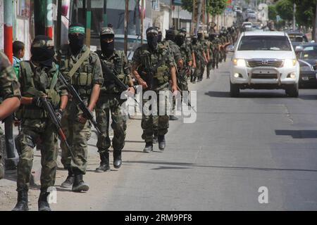 (140529) -- GAZA, 29 mai 2014 (Xinhua) -- des militants palestiniens du Hamas participent à un défilé militaire dans la ville de Rafah, dans le sud de la bande de Gaza, le 29 mai 2014. (Xinhua/Khaled Omar) MIDEAST-GAZA-MILITARY-PARADE PUBLICATIONxNOTxINxCHN Gaza 29 2014 mai un militant PALESTINIEN du Hamas XINHUA participe à un défilé militaire dans le sud de la bande de Gaza ville de Rafah LE 29 2014 mai XINHUA Khaled Omar Mideast Gaza Parade militaire PUBLICATIONxNOTxINxCHN Banque D'Images