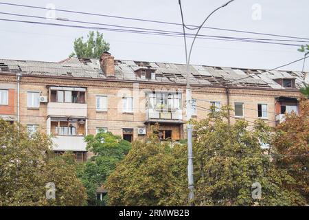 Missile attack in Kyiv, Ukraine, august 2023. Broken windows and roof after explosion. House damaged by blast wave. War in Ukraine Stock Photo