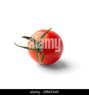 One fresh organic cherry tomato with green tail isolated on white background closeup. Products for a healthy diet. Stock Photo