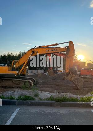 Tyumen, Russia-August 05, 2023: Hyundai logo on crane, on excavator, Hyundai car dealer. Vertical photo Stock Photo