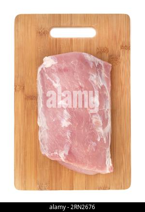 Morceau de viande de porc crue sur une planche à découper en bois. Carbonade. Viande biologique crue. Banque D'Images