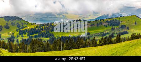 Large panorama of the beautiful mountainous landscape with the cogwheel railway track and the famous Lake Lucerne in the background, seen from the... Stock Photo