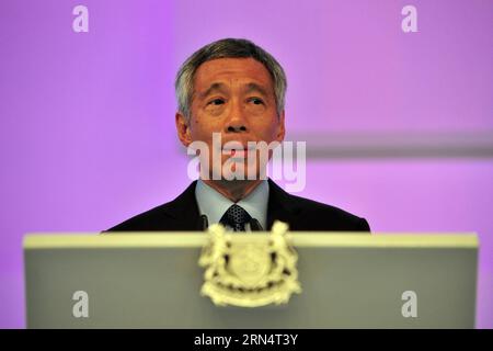 (150529) -- SINGAPOUR, le 29 mai 2015 -- le Premier ministre de Singapour, Lee Hsien Loong, prononce un discours liminaire lors du dîner d'ouverture du dialogue Shangril-la, à Singapour, le 29 mai 2015. Le 14e dialogue Shangri-la, largement reconnu comme le plus important sommet de défense et de sécurité de la région Asie-Pacifique, a débuté vendredi à Singapour. (lrz) SINGAPOUR-14E DIALOGUE SHANGRI-LA ThenxChihxWey PUBLICATIONxNOTxINxCHN 150529 Singapour Mai 29 2015 Singapour les premiers ministres Lee Hsien Loong prononce un discours liminaire au dîner d'ouverture du dialogue la à Singapour 29 2015 Mai 14e dialogue Shangri la Banque D'Images