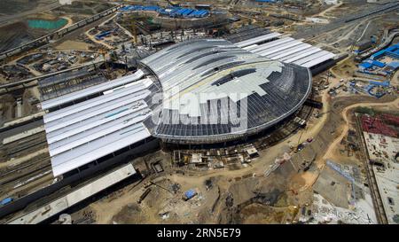 (150623) -- URUMQI, June 23, 2015 -- Photo taken with a drone on May 21, 2015 shows the high speed railway station under construction in Urumqi, capital of northwest China s Xinjiang Uygur Autonomous Region. The 1,776-kilometer Lanxin high-speed railway was put into operation on Dec. 26, 2014, linking Lanzhou, capital of Gansu Province, Xining, capital of Qinghai Province, and Urumqi, all in northwest China. In 2015, aerial photos of the Xinjiang section of Lanxin high-speed railway were taken by an aerial photography group of Xinhua News Agency and various landforms of Xinjiang have been reco Banque D'Images