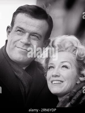 1970s PORTRAIT OF SMILING STYLISH MIDDLE-AGED MATURE COUPLE HUGGING LOOKING UP OFF CAMERA - p7966 HAR001 HARS HEALTHINESS COPY SPACE FRIENDSHIP LADIES PERSONS CARING MALES CONFIDENCE MIDDLE-AGED B&W PARTNER MIDDLE-AGED MAN DREAMS HAPPINESS MIDDLE-AGED WOMAN HEAD AND SHOULDERS CHEERFUL SOPHISTICATED HANDSOME UP SMILES UPSCALE CONNECTION JOYFUL STYLISH SUPPORT PERSONAL ATTACHMENT AFFECTION CHARMING CHIC EMOTION LOOKING UP TOGETHERNESS WIVES BLACK AND WHITE CAUCASIAN ETHNICITY HAR001 OLD FASHIONED Stock Photo